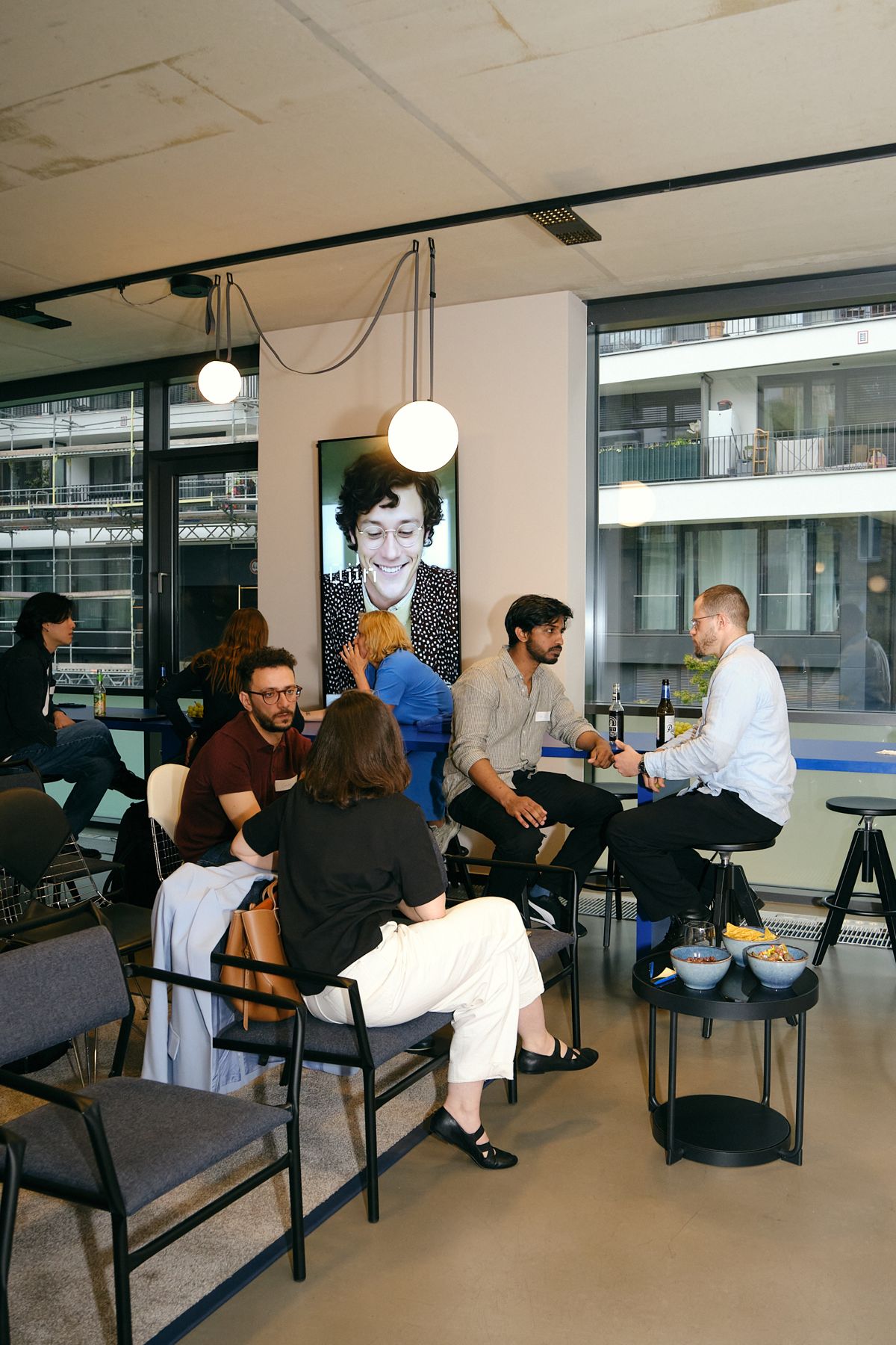 Guests settling in and talking before the demos
