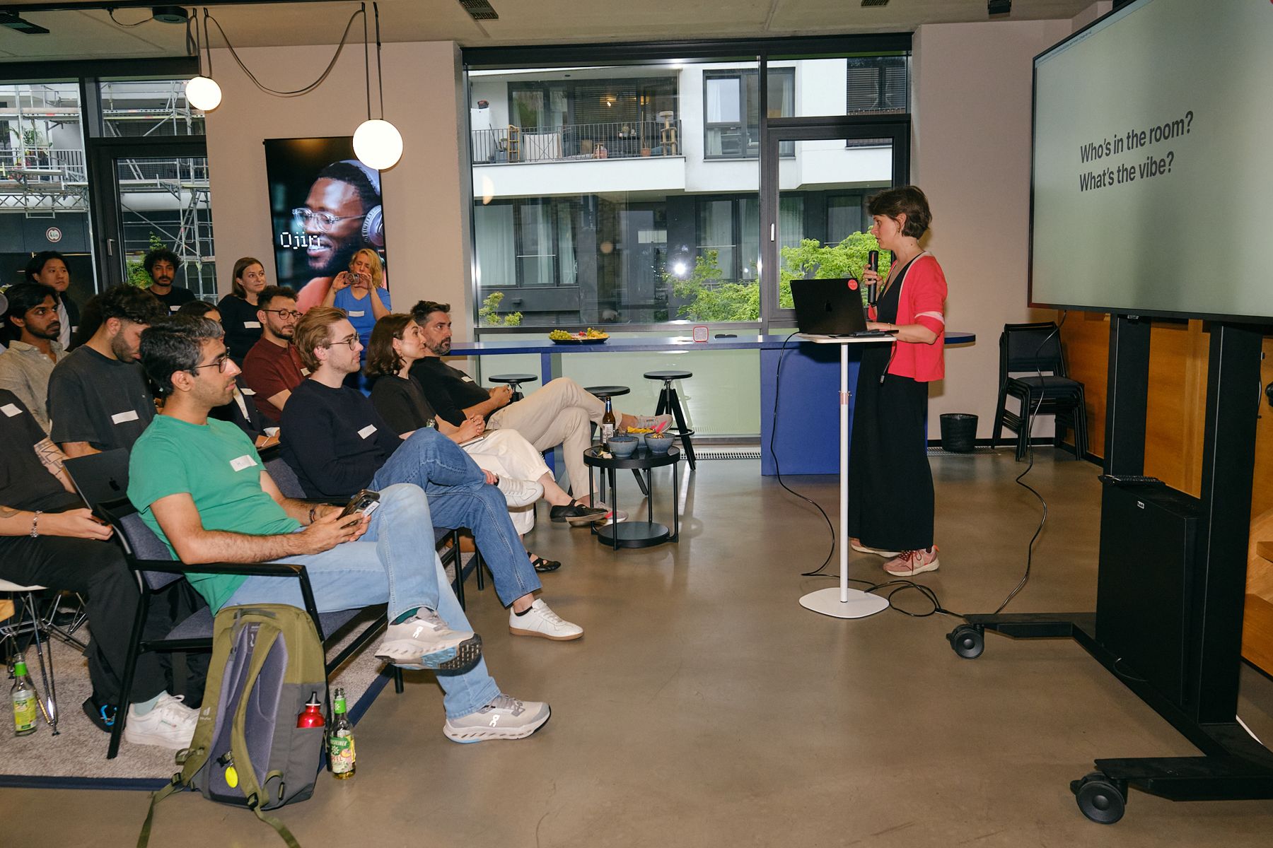 Guests watching a demo at One Last Prompt in Berlin